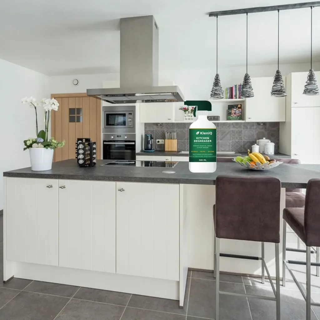 KleniQ Kitchen Degreaser on a kitchen counter (stock photo with illustrative product render)